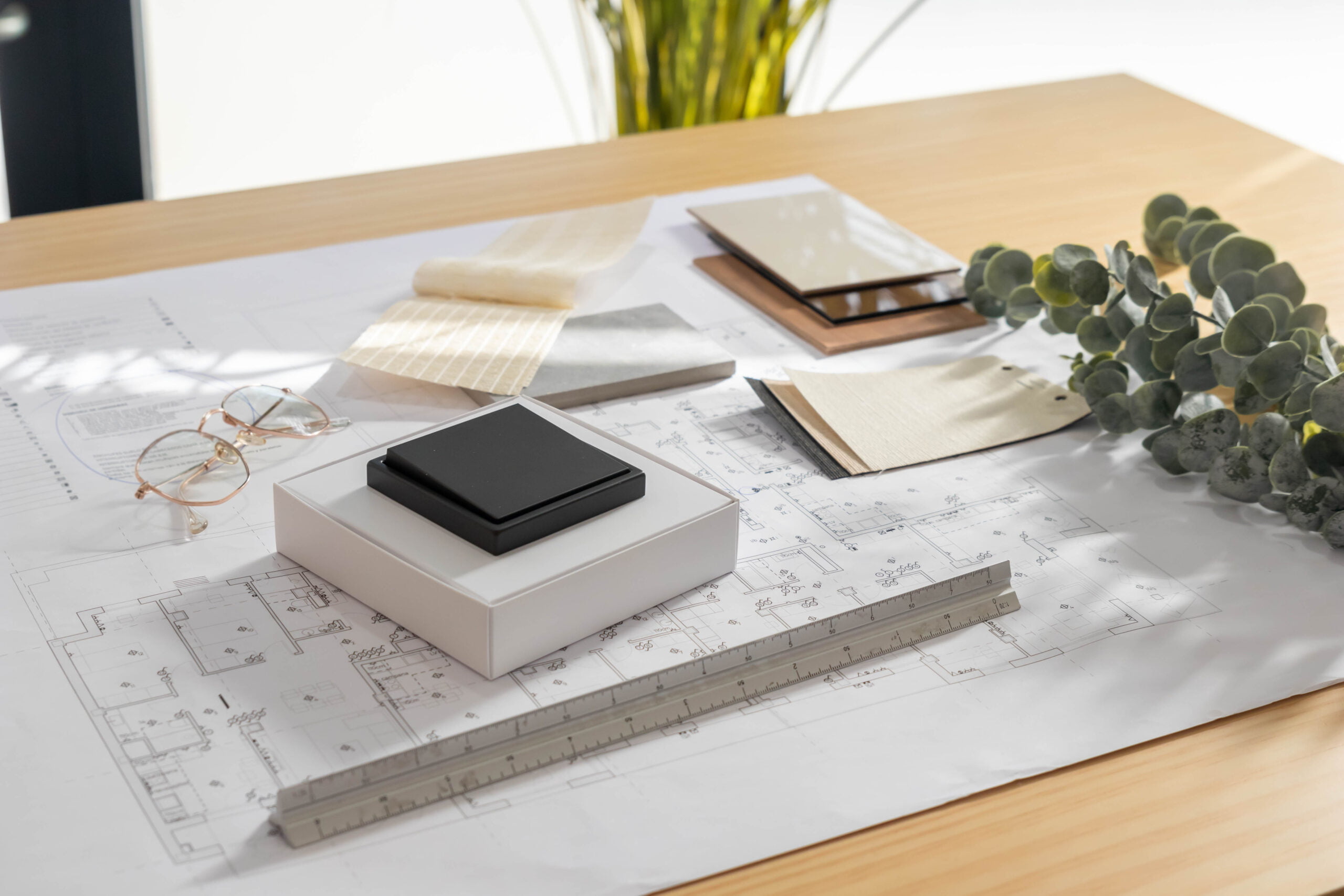 View of different material selection moodboard with samples of switch, wood, textile and stone