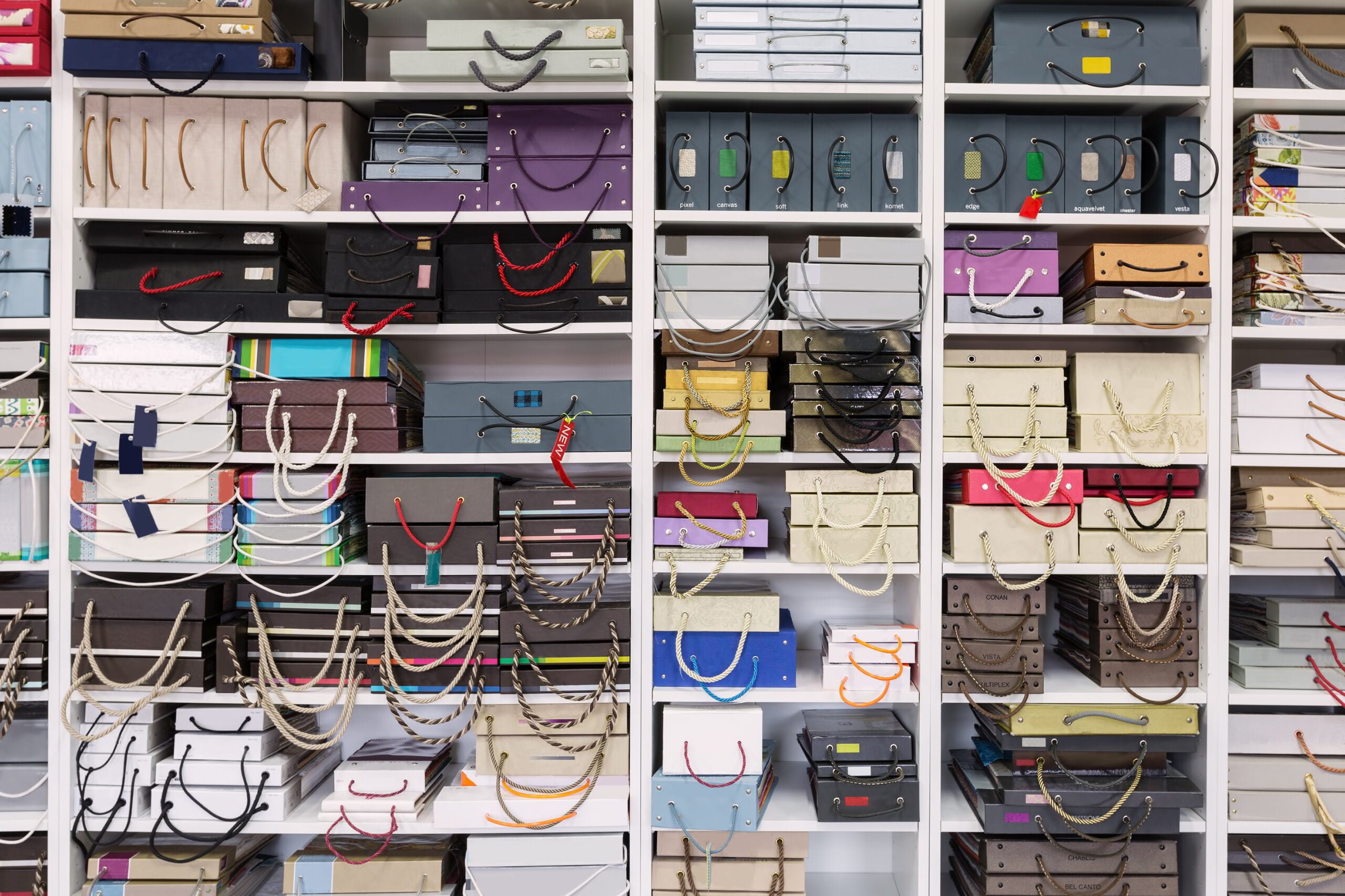 Multicolor samples folders catalog with blank label on shelves